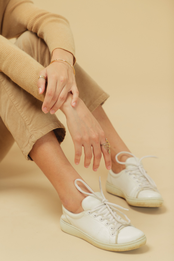 Woman in Beige Monochrome Outfit on Beige Background